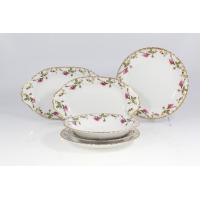 Serwis obiadowy Chodzież Iwona B013 dla 12 osób. Biała porcelana z delikatnym motywem róż i złotym wykończeniem brzegów. Zestaw obejmuje talerze oraz półmiski.
