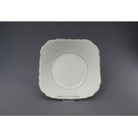 Biała salaterka kwadratowa 24 cm z serii ROCOCO marki Ćmielów. Naczynie z porcelany o eleganckim, reliefowym zdobieniu na brzegach i delikatnym złotym