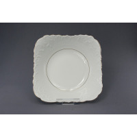 Biała salaterka kwadratowa 27 cm 3604 Rococo marki Ćmielów. Naczynie z porcelany o falistych brzegach i reliefowym zdobieniu, wykończone delikatną złotą linią.