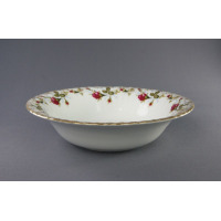 Okrągła salaterka Chodzież Iwona B013 o średnicy 26 cm z białej porcelany, zdobiona klasycznym motywem róż i złotym wykończeniem krawędzi, widok z profilu.