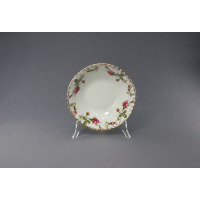 Salaterka okrągła 16 cm B013 Iwona marki Chodzież z białej porcelany, ozdobiona klasycznym motywem róż i złotym wykończeniem brzegów, wyeksponowana na