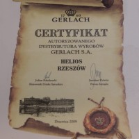 Certyfikat autoryzowanego dystrybutora wyrobów Gerlach S.A. dla firmy Helios Rzeszów z 2009 roku, stylizowany na stary dokument z pieczęcią lakową i logo marki.