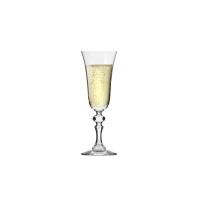 Kieliszek do szampana Krista marki Krosno Glass o eleganckim, fasetowanym trzonku, wypełniony musującym trunkiem z widocznymi bąbelkami, na białym tle.