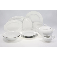 Biały serwis obiadowy Chodzież YVETTE dla 12 osób. Zestaw 44 części z porcelany, obejmujący talerze, miski, wazę i sosjerkę, wyeksponowany na jasnym tle.