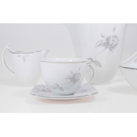 Elegancki garnitur do kawy E758 AKCENT marki Chodzież. Biała porcelana z subtelnym, szarym motywem róż, wykończona srebrną linią. Widok na filiżankę ze