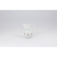 Biały porcelanowy dzbanek do mleczka 200 ml JASTRA marki Lubiana. Naczynie o pękatym kształcie zdobią delikatne motywy drobnych niebieskich i różowych kwiatów.