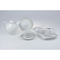 Elegancki zestaw kawowy Chodzież E615 Yvonne dla 12 osób. Biała porcelana z subtelnym srebrnym zdobieniem, obejmująca dzbanek, filiżankę, talerzyk, cukiernicę