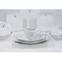 Elegancki garnitur do kawy Ćmielów E635 Akcent dla 12 osób. Biała porcelana o kwadratowym kształcie ze srebrnym zdobieniem w geometryczne wzory na naczyniach.