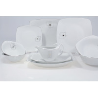 Serwis obiadowy Chodzież E635 Akcent dla 12 osób. Białe porcelanowe naczynia o kwadratowym kształcie z geometrycznym srebrnym wzorem i delikatną obwódką na