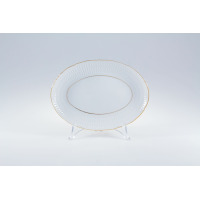 Owalna rawierka Ćmielów 24 cm z kolekcji Sofia. Biała porcelana z delikatnym reliefem na brzegach, wykończona subtelną złotą linią, ustawiona na przezroczystym