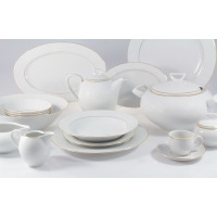 Elegancki serwis obiadowo-kawowy Chodzież 3604 YVONNE dla 12 osób. Biała porcelana z subtelnym złotym zdobieniem na brzegach naczyń, w tym talerzy, wazy i