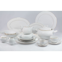 Elegancki serwis obiadowo-kawowy Chodzież 3604 YVONNE dla 12 osób. Biała porcelana ze złotym obrzeżem, obejmująca talerze, wazę, dzbanek, filiżanki i mlecznik.