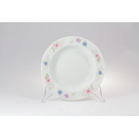 Talerz głęboki 23 cm G679 YVETTE marki Chodzież z porcelany o białym odcieniu, ozdobiony delikatnym motywem kwiatowym w odcieniach różu i błękitu na rancie.