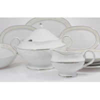 Elegancki serwis obiadowy Ćmielów B601 Astra dla 6 osób. Biała porcelana z subtelnym roślinnym motywem i srebrnym zdobieniem, widoczna waza z pokrywką oraz