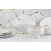 Elegancki serwis obiadowy Ćmielów G067 Astra Złota Wstęga dla 6 osób. Biała porcelana ze złotym zdobieniem, obejmująca wazę, sosjerkę i zestaw talerzy.
