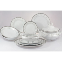 Elegancki serwis obiadowy Ćmielów E361 Bolero Vera dla 6 osób. Biała porcelana z subtelnym srebrnym zdobieniem, obejmująca talerze, wazę i sosjerkę na jasnym