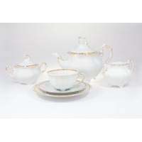 Elegancki zestaw do herbaty Ćmielów Bolero dla 6 osób. Biała porcelana ze złotym zdobieniem, obejmująca dzbanek, cukiernicę, mlecznik oraz filiżankę ze