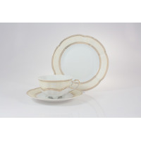 Zestaw do herbaty Ćmielów E363 Bolero dla 6 osób: elegancka porcelanowa filiżanka ze spodkiem oraz talerzyk deserowy w kremowym odcieniu ze złotym zdobieniem.