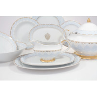 Serwis obiadowy Ćmielów G684 Astra Królewski błękit. Zestaw 25 części z porcelany w kolorze białym z błękitnym ornamentem i złotymi zdobieniami na krawędziach.