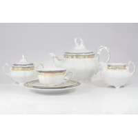 Zestaw do herbaty Ćmielów E551 Bolero Princess dla 6 osób. Biała porcelana z eleganckim złotym i szarym zdobieniem, obejmująca dzbanek, cukiernicę, mlecznik