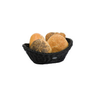 Czarny owalny kosz do pieczywa Saleen o plecionej strukturze, wypełniony czterema różnymi bułkami. Praktyczny dodatek kuchenny o wymiarach 23,5 cm.