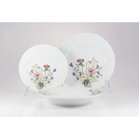 Zestaw talerzy Chodzież G762 Yvette dla 6 osób. Komplet białej porcelany z delikatnym motywem polnych kwiatów, obejmujący dwa płaskie talerze i głęboką misę.
