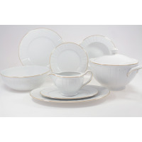 Serwis obiadowy Ćmielów G311 Oktawa dla 6 osób. Biała porcelana z delikatnym złotym zdobieniem, obejmująca talerze, wazę, sosjerkę i misę na jasnym tle.