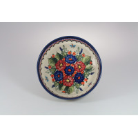 Ceramiczna miska Bolesławiec 17 cm GU-1152 z ręcznie malowanym wzorem kwiatowym w odcieniach niebieskiego i czerwieni, widok z góry na wnętrze naczynia.