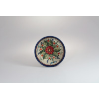 Ceramiczna miska Bolesławiec 12,5 cm GU-1246A z ręcznie malowanym motywem czerwonego kwiatu i zielonych liści na jasnym tle, widok z góry na wnętrze naczynia.
