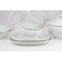 Elegancki serwis obiadowy Ćmielów 3604 ROCOCO dla 6 osób. Biała porcelana z subtelnym tłoczeniem i złotym wykończeniem, prezentująca sosjerkę na półmisku oraz