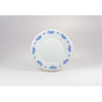 Talerz deserowy 19 cm G540 ALASKA marki Ćmielów z białej porcelany. Okrągły talerz zdobiony subtelnym, niebieskim motywem kwiatowym na obrzeżach i złotym