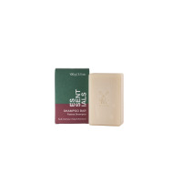 Szampon w kostce Mühle z serii Essentials o zapachu figi i rozmarynu obok zielono-bordowego opakowania z logo marki i napisem 100g | 3.5 oz.