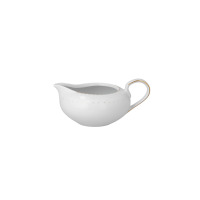 Sosjerka z serwisu obiadowego Yvonne Bella marki Chodzież. Biała porcelana o opływowym kształcie, zdobiona subtelnym złotym wzorem przy krawędzi i eleganckim