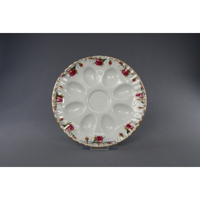 Okrągły półmisek na jaja Chodzież Iwona Złota róża o średnicy 21 cm. Biała porcelana z motywem róż i złotym wykończeniem, posiada osiem wgłębień na jajka.
