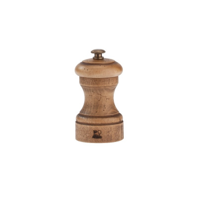 Młynek do soli Peugeot Paris Antique o wysokości 10 cm. Wykonany z postarzanego drewna o widocznej fakturze, z metalowym pokrętłem regulacji mielenia na górze.