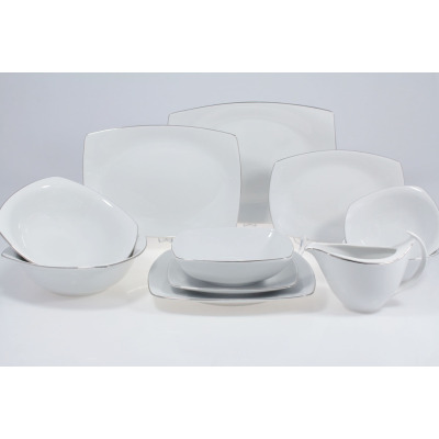 Serwis obiadowy Chodzież 9718 Akcent Platynowa linia dla 12 osób. Białe porcelanowe naczynia o nowoczesnym, kwadratowym kształcie z delikatnym, srebrnym