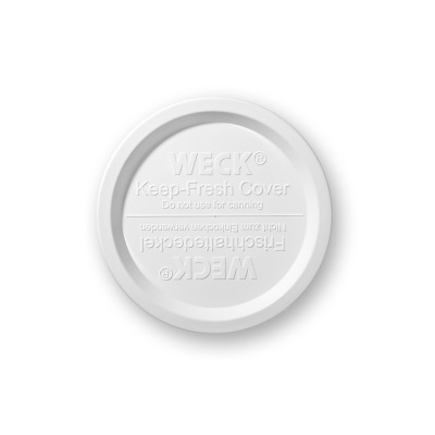 Biała, okrągła pokrywka WECK Keep Fresh 120 mm do słoików. Widok z góry na tłoczone napisy: WECK Keep-Fresh Cover oraz ostrzeżenie o zakazie używania do