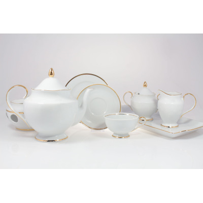 Zestaw do herbaty Ćmielów G067 Astra Złota wstęga dla 6 osób. Biała porcelana z delikatnym złotym zdobieniem, obejmująca dzbanek, filiżankę, spodek, cukiernicę