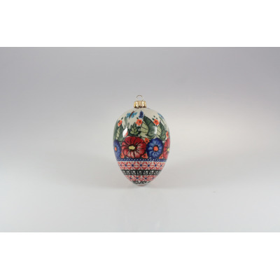 Ozdoba choinkowa Bolesławiec 149AR o wysokości 11 cm. Ceramiczne jajko z ręcznie malowanym motywem kwiatowym w czerwieni i błękicie oraz geometrycznym wzorem u