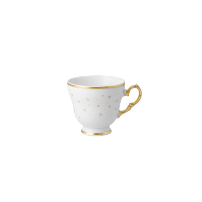 Biała porcelanowa filiżanka Ćmielów 0,17 l z kolekcji BN07 Alaska Blask Świąt. Naczynie zdobią złote gwiazdki oraz eleganckie złocenia na krawędzi, stopce i
