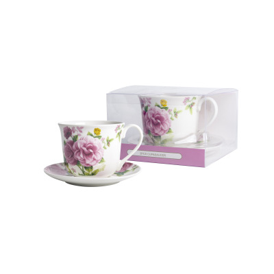 Filiżanka 400 ml ze spodkiem Kaczyński Sp.J. CR1-19 z motywem różowych kwiatów, ustawiona obok przezroczystego opakowania z napisem 2PCS CUP&SAUCER.